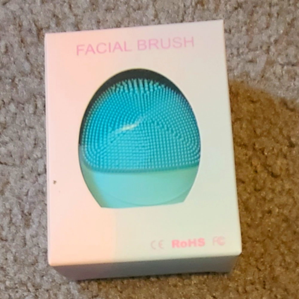 Battery operated facial brush. New in original box